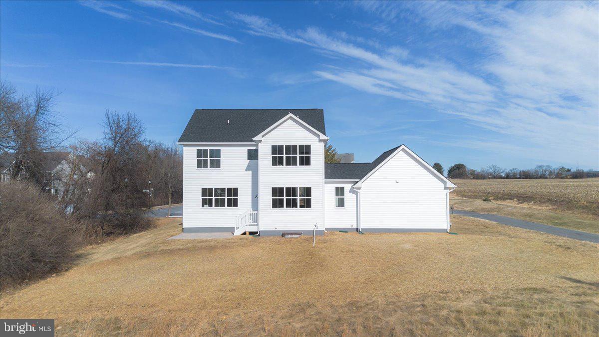 641 Swallowtail Drive Frederick, MD 21703 - Photo 51 of 52 a front view of a house with a yard