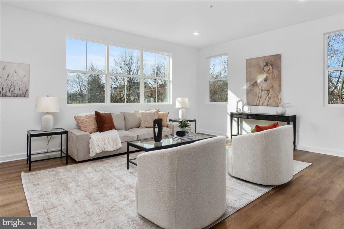 641 Swallowtail Drive Frederick, MD 21703 - Photo 10 of 52 a living room with furniture and a large window