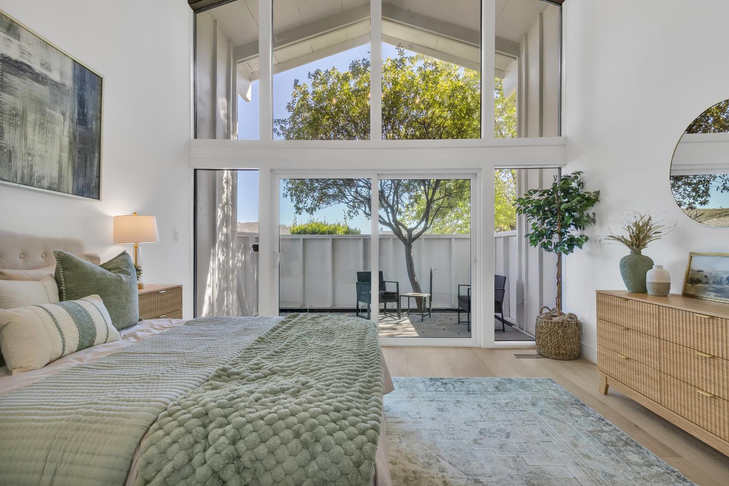 3053 Boeing Road Cameron Park, CA 95682 - Photo 25 of 67 a large bed sitting in a bedroom next to a window