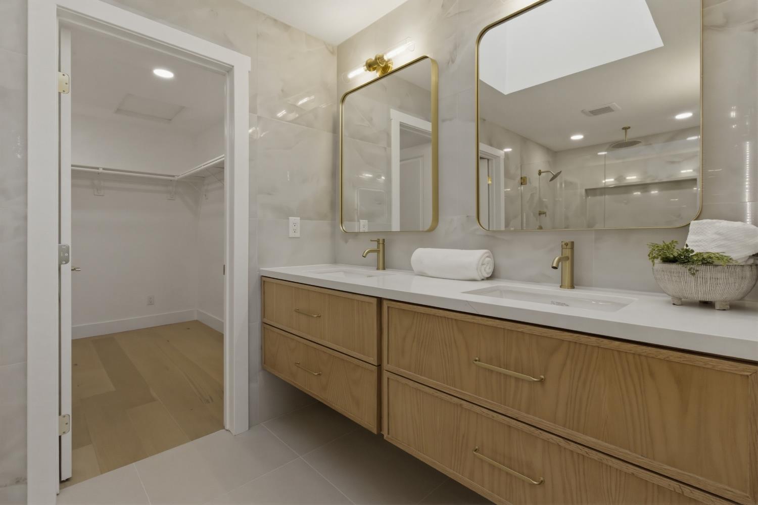3053 Boeing Road Cameron Park, CA 95682 - Photo 27 of 67 a bathroom with a double vanity sink mirror and double