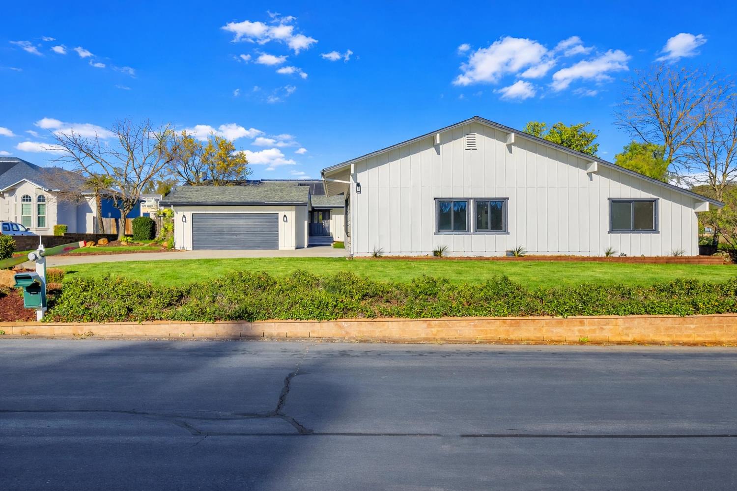 3053 Boeing Road Cameron Park, CA 95682 - Photo 3 of 67 a view of a house with a yard and potted plants