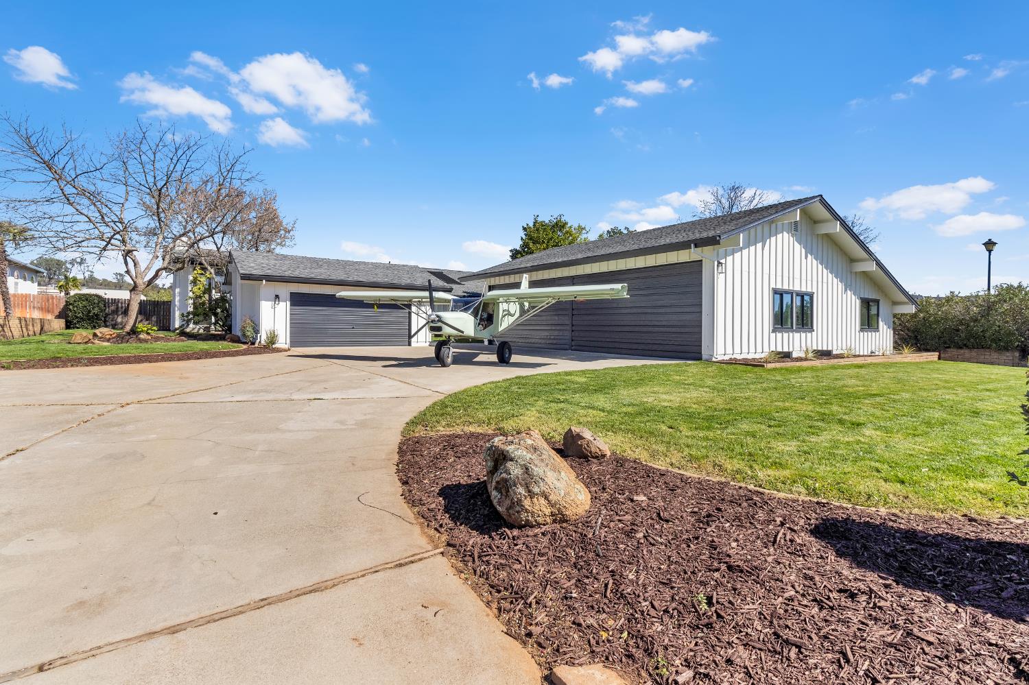 3053 Boeing Road Cameron Park, CA 95682 - Photo 5 of 67 a view of a house with backyard and sitting area