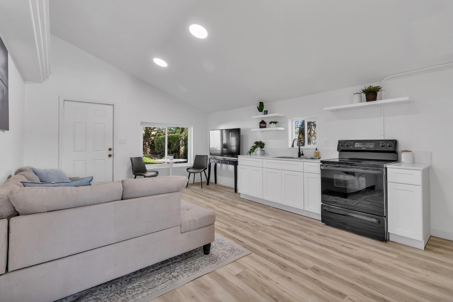3053 Boeing Road Cameron Park, CA 95682 - Photo 56 of 67 a living room with furniture and a wooden floor