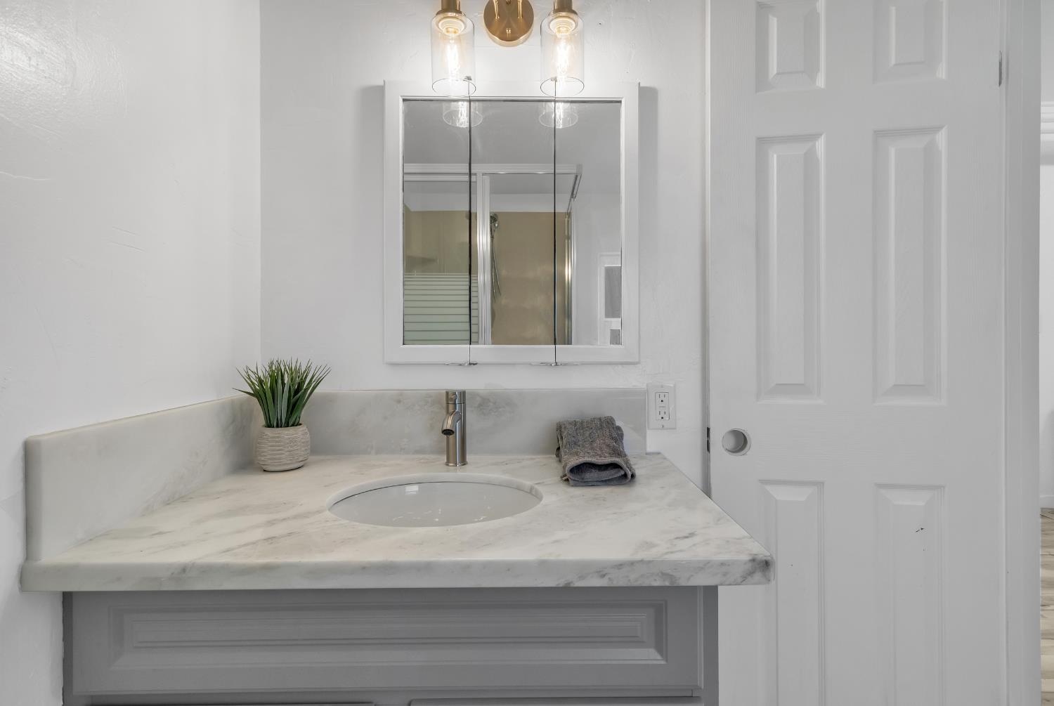 3053 Boeing Road Cameron Park, CA 95682 - Photo 60 of 67 a bathroom with a sink and a mirror