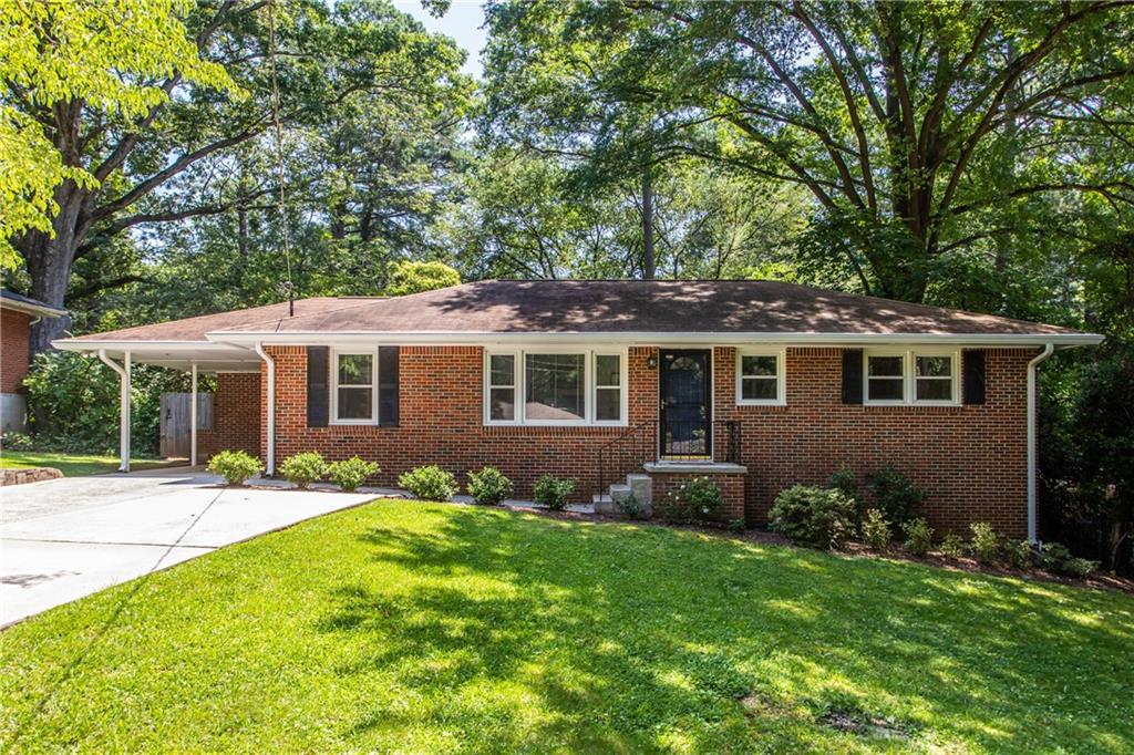 1041 Homewood Court Decatur, GA 30033 - Photo 1 of 1 a front view of a house with a garden