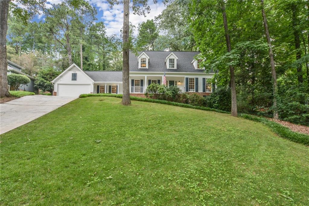 Beautifully LANDSCAPED yard and picturesque porch sets off the CURB APPEAL!!