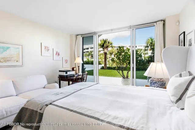 a bed room with a bed and a chair