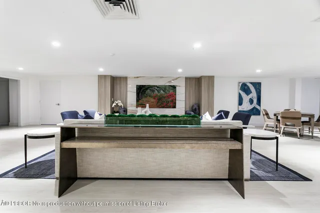 a kitchen with granite countertop a stove microwave and sink