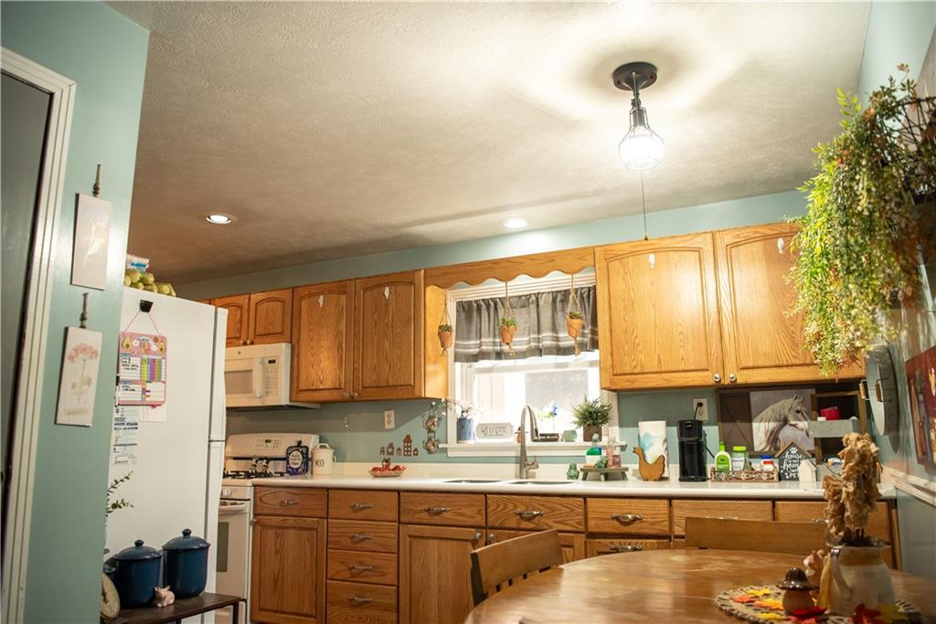 112 Sipes Road Freeport, PA 16229 - Photo 4 of 14 a kitchen with a refrigerator and a sink