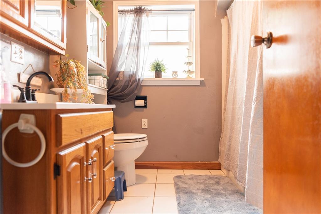 112 Sipes Road Freeport, PA 16229 - Photo 6 of 14 a bathroom with a sink a toilet and a window