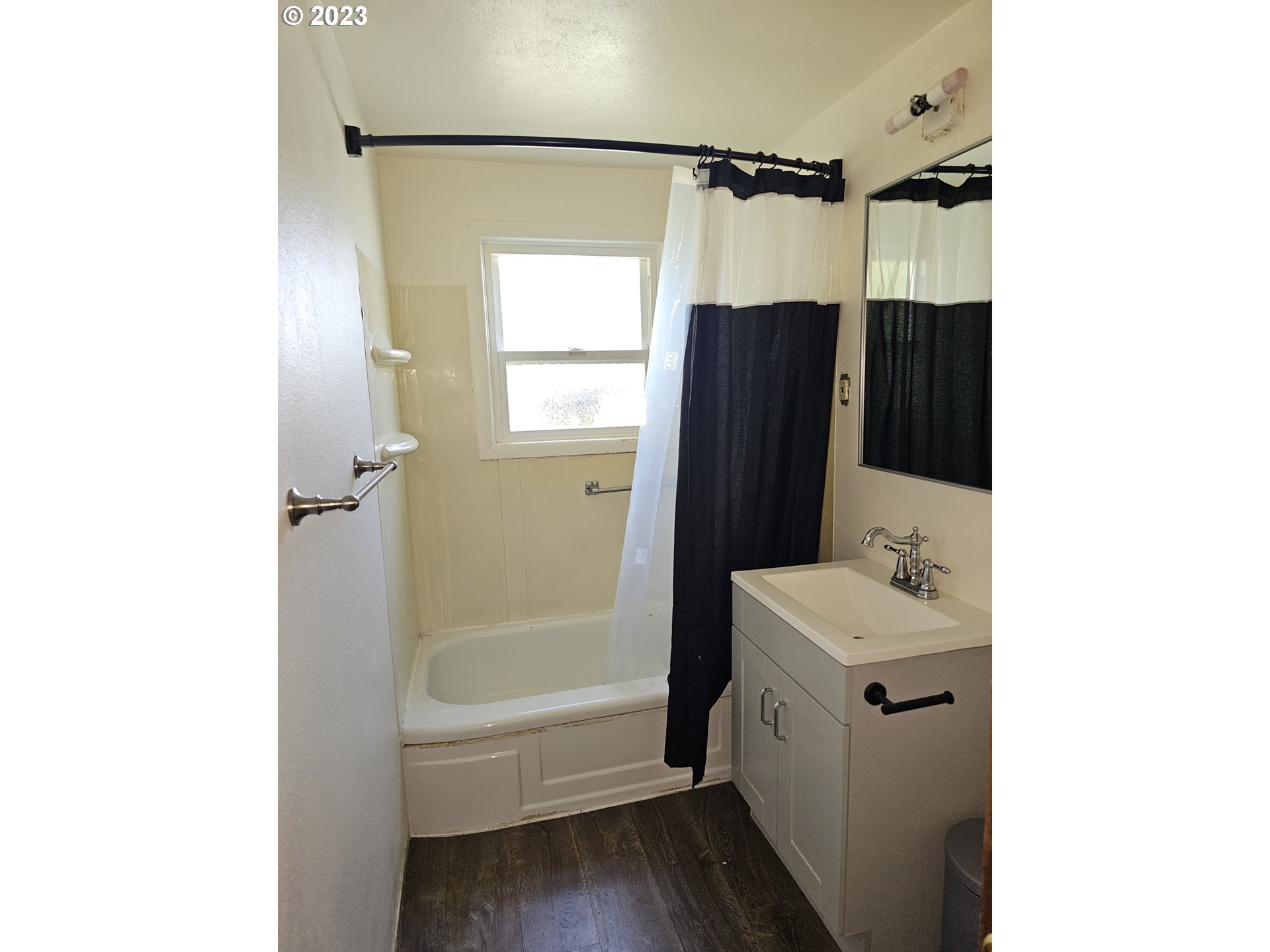 1278 M Street Springfield, OR 97477 - Photo 11 of 13 a bathroom with a sink a toilet and shower