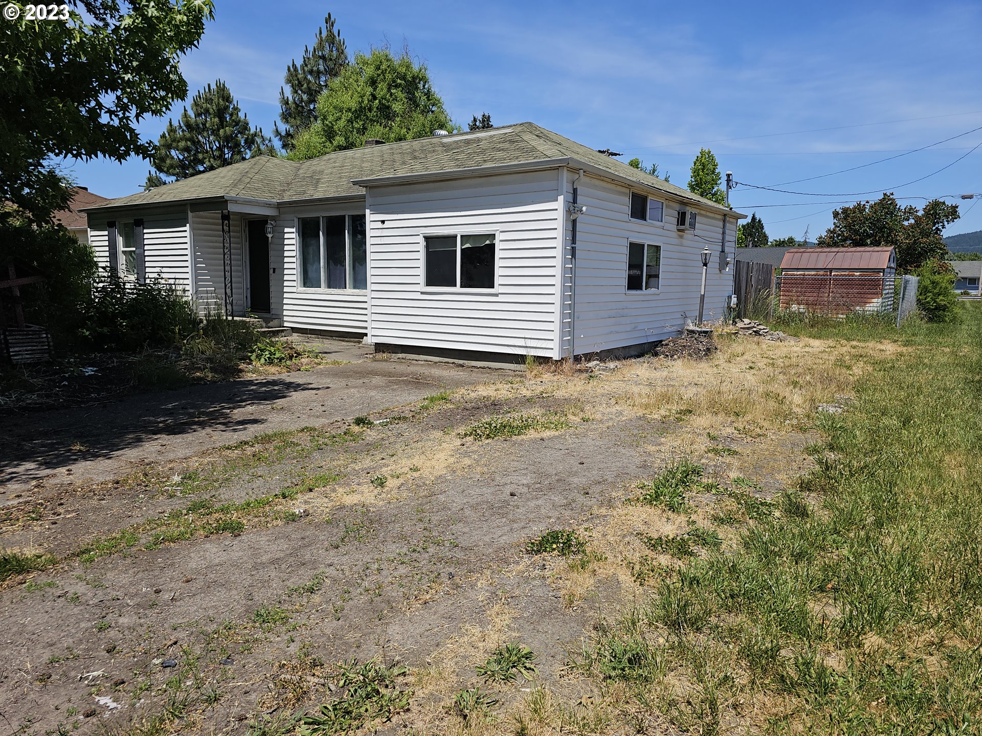1278 M Street Springfield, OR 97477 - Photo 2 of 13 a view of a house with a yard