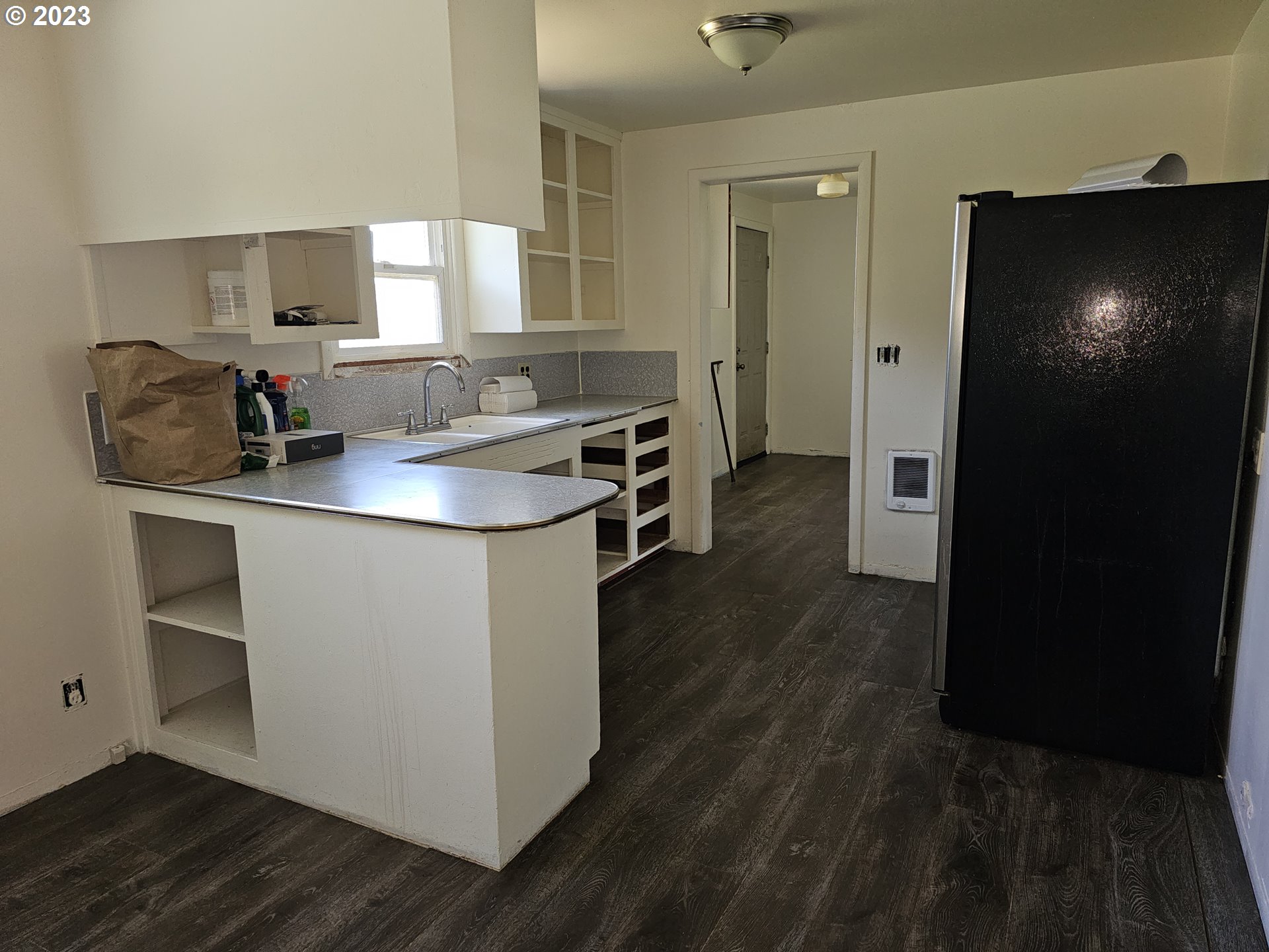 1278 M Street Springfield, OR 97477 - Photo 6 of 13 a kitchen with stainless steel appliances granite countertop a sink stove and refrigerator