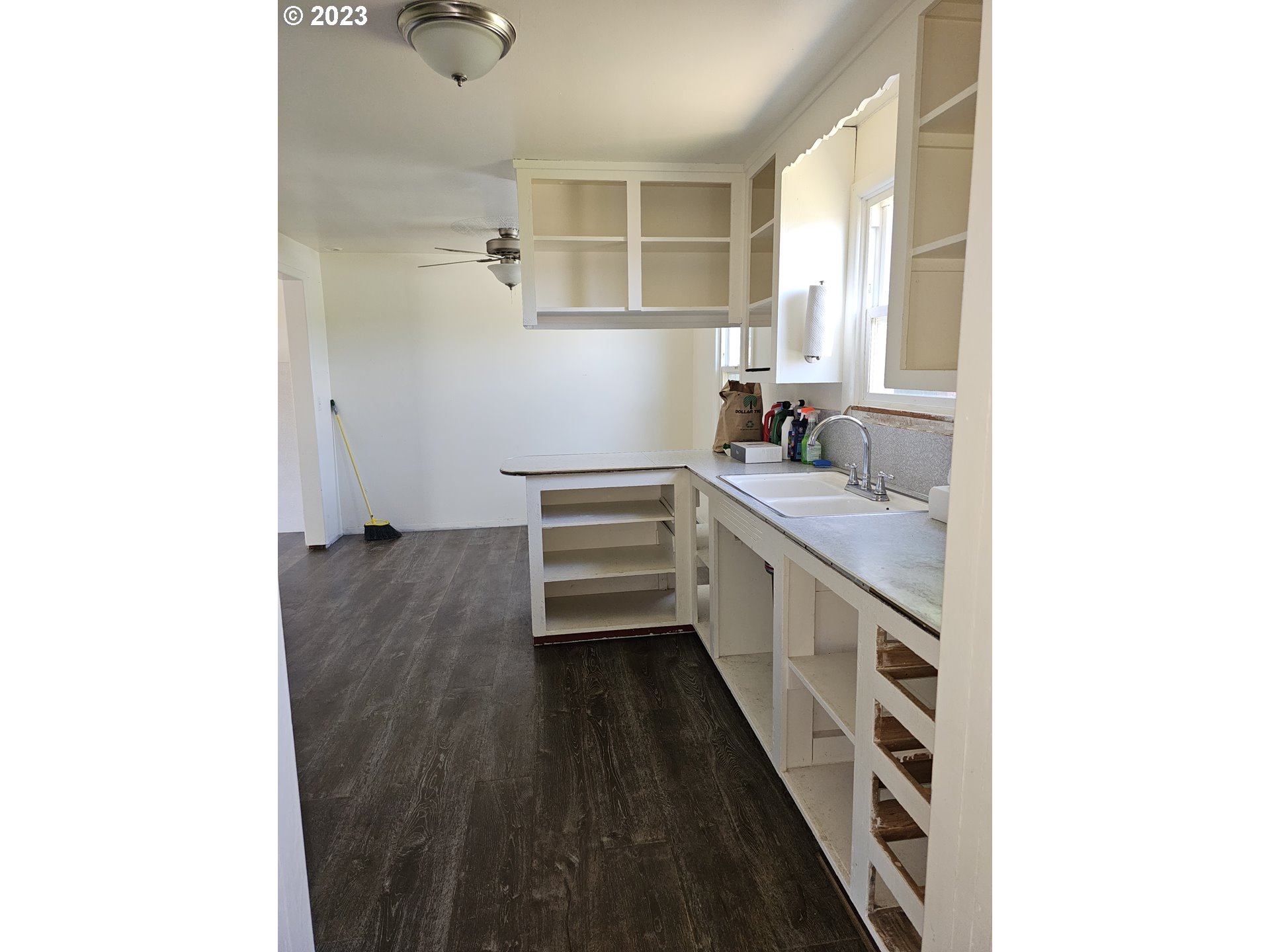 1278 M Street Springfield, OR 97477 - Photo 7 of 13 a kitchen with a sink a window and cabinets
