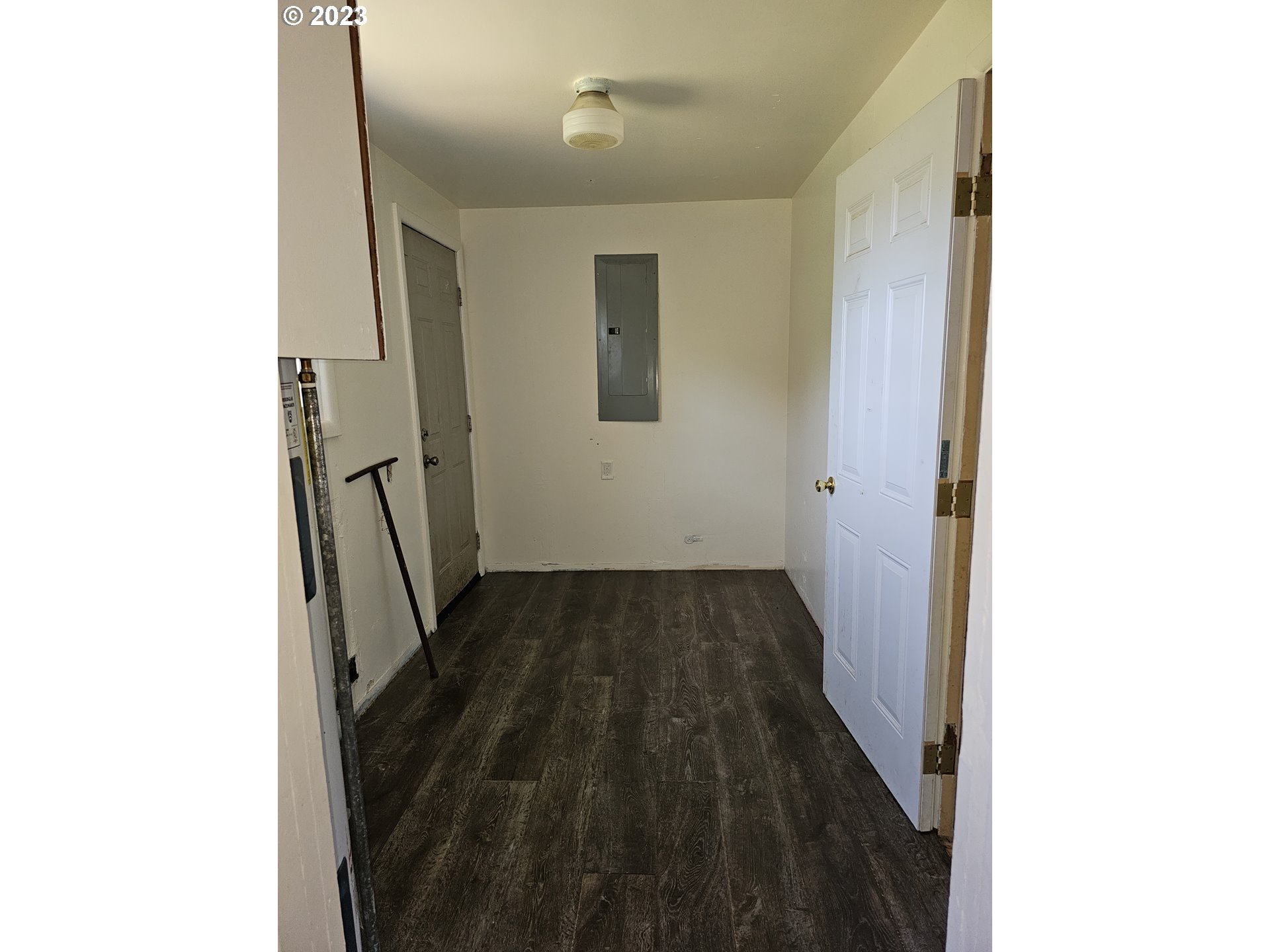 1278 M Street Springfield, OR 97477 - Photo 8 of 13 a view of a hallway with wooden floor
