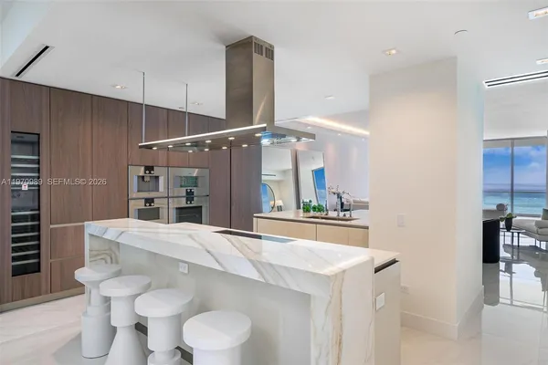 a kitchen with a table and chairs