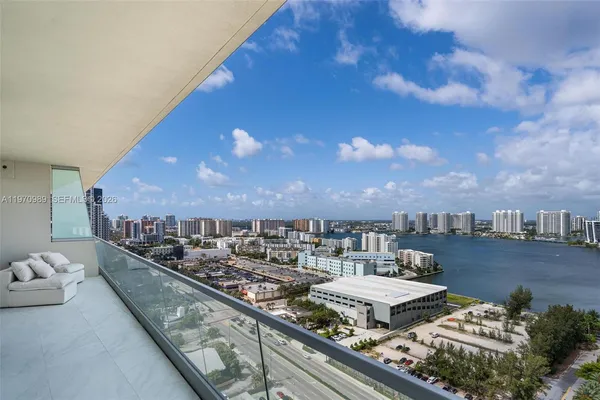 a view of a balcony with two chairs