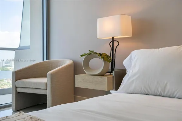a view of a dining room with furniture and a mirror