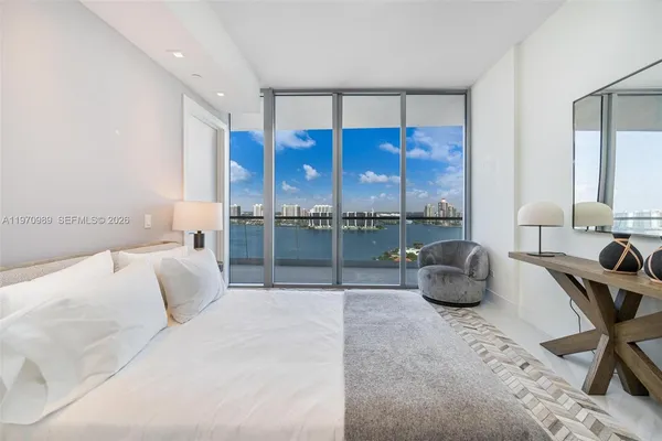 a bathroom with a tub shower and sink