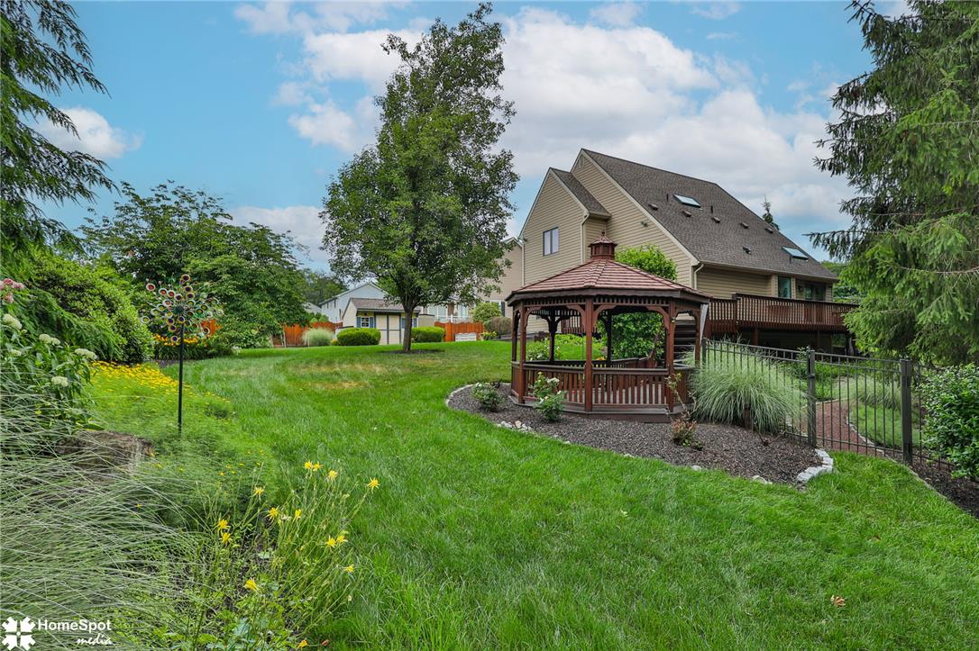 2821 Center Street Bethlehem, PA 18017 - Photo 61 of 68 An inviting backyard oasis offers a charming gazebo, lush lawn, and private deck for outdoor enjoyment.
