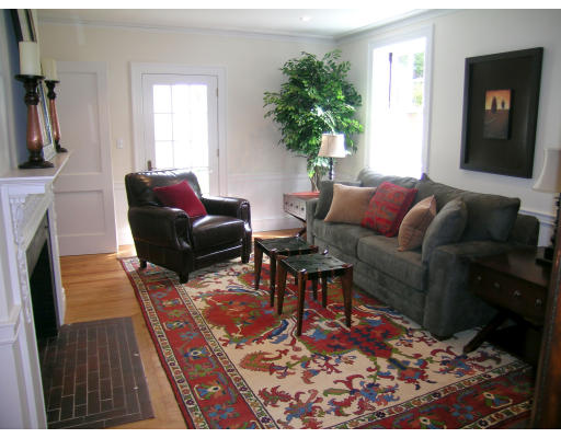 175 Middlesex Road Brookline, MA 02467 - Photo 3 of 11 a living room with furniture a rug and a potted plant