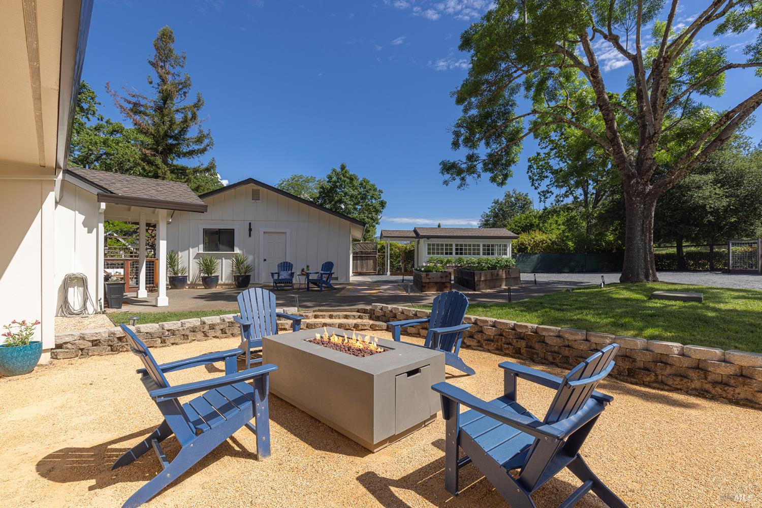 14734 Young Road Healdsburg, CA 95448 - Photo 5 of 47 a view of a house with backyard and sitting area