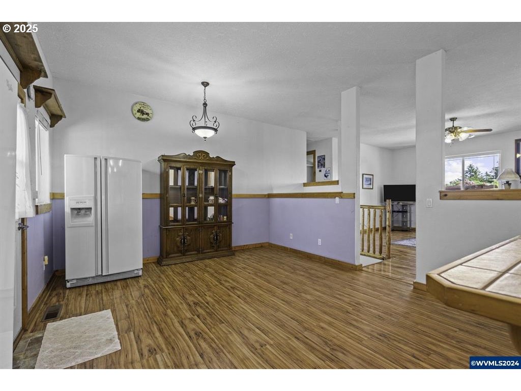 5465 Sams Place Southeast Turner, OR 97392 - Photo 12 of 46 a view empty room with wooden floor and window