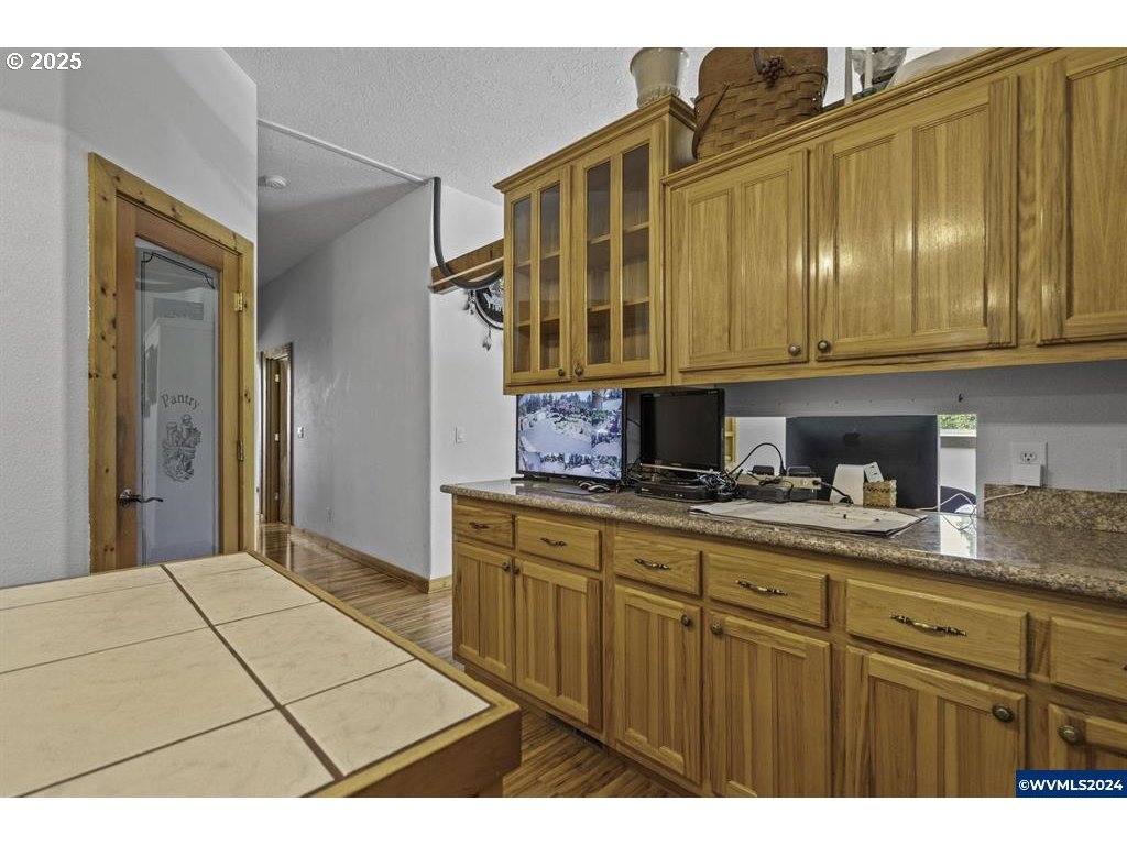 5465 Sams Place Southeast Turner, OR 97392 - Photo 16 of 46 a kitchen with stainless steel appliances granite countertop a cabinets