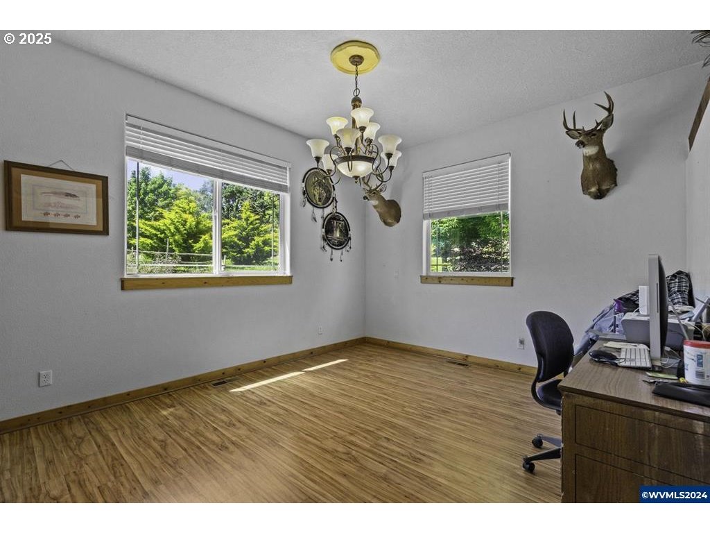5465 Sams Place Southeast Turner, OR 97392 - Photo 17 of 46 a view of a workspace with furniture and a window