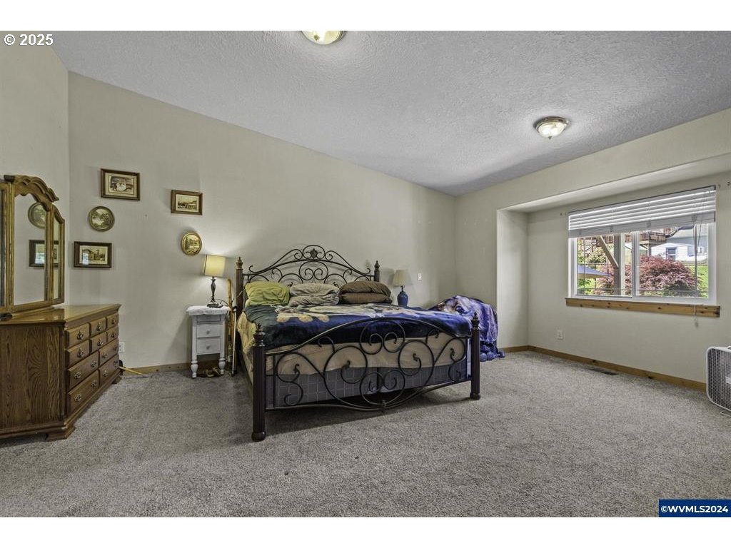 5465 Sams Place Southeast Turner, OR 97392 - Photo 22 of 46 a bedroom with a bed and a window