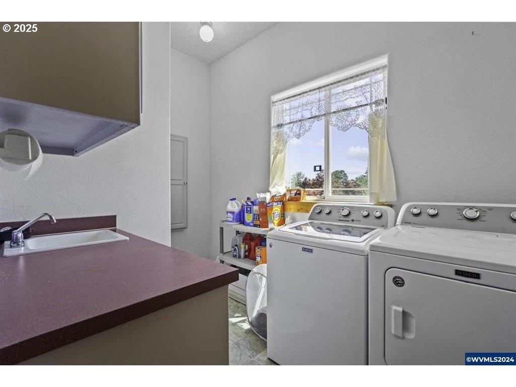 5465 Sams Place Southeast Turner, OR 97392 - Photo 27 of 46 a utility room with dryer and washer