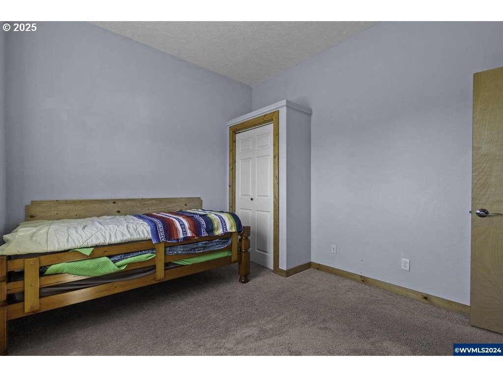 5465 Sams Place Southeast Turner, OR 97392 - Photo 30 of 46 a bedroom with a bed and window