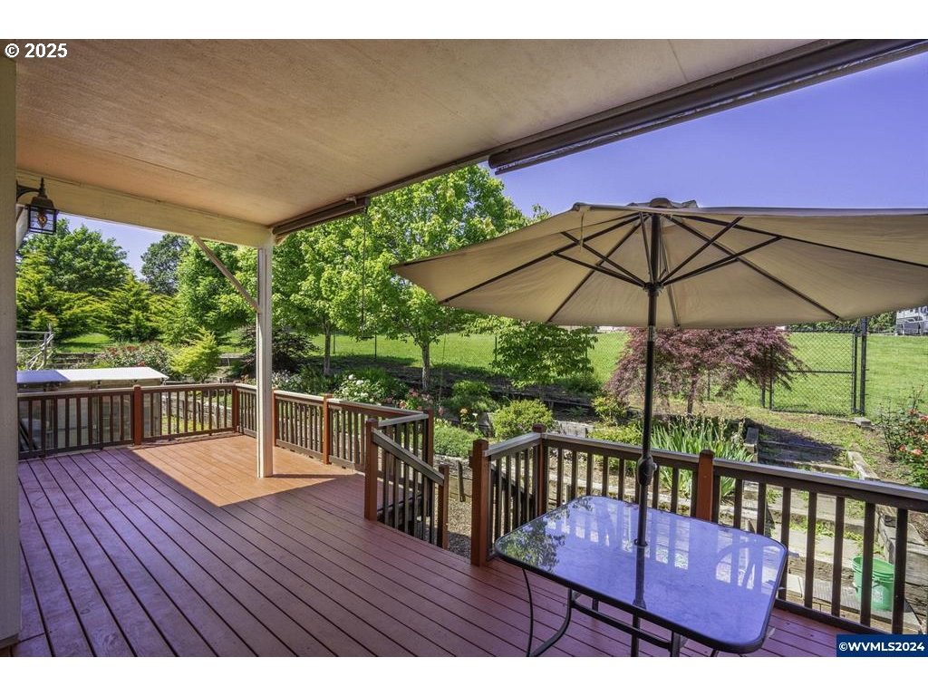 5465 Sams Place Southeast Turner, OR 97392 - Photo 32 of 46 a view of balcony with wooden floor and umbrella