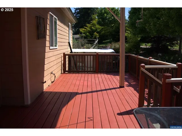 a view of balcony with wooden floor and outdoor seating
