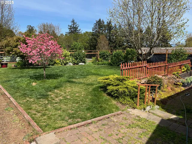 a view of a backyard with sitting area
