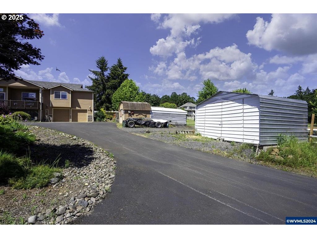 5465 Sams Place Southeast Turner, OR 97392 - Photo 4 of 46 a picture of a houses with a yard