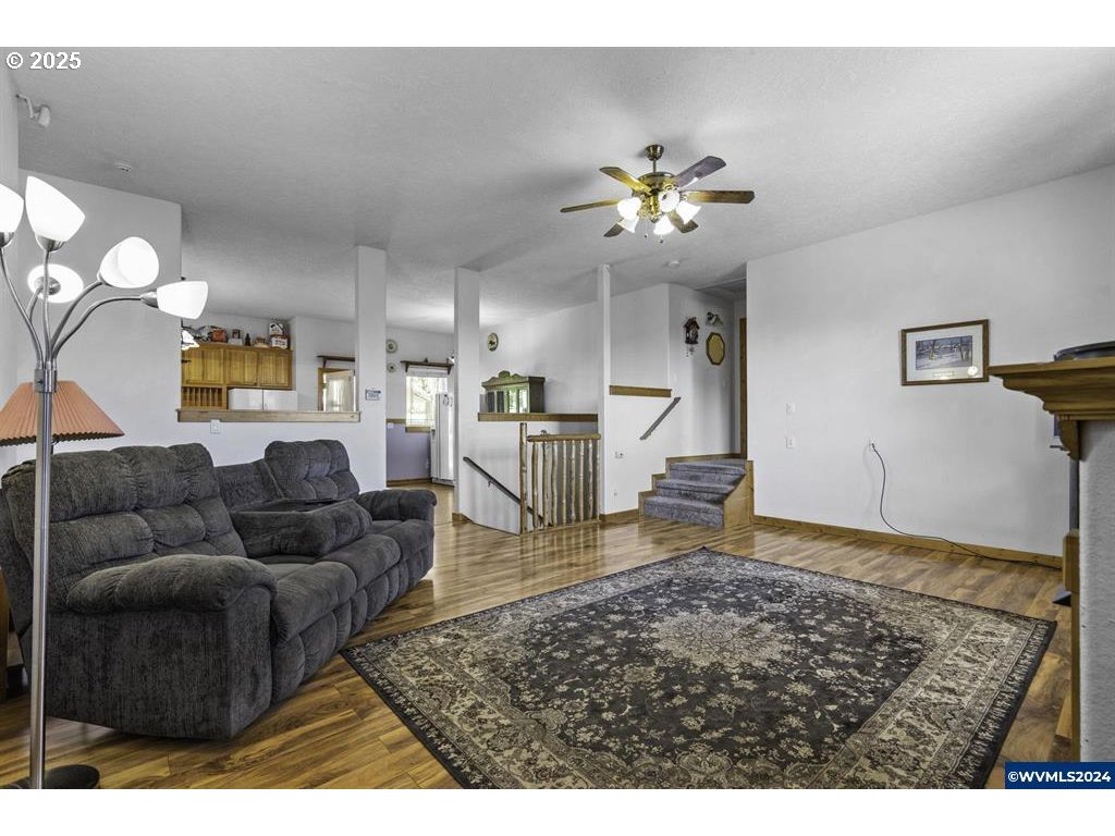 5465 Sams Place Southeast Turner, OR 97392 - Photo 6 of 46 a living room with furniture and a rug