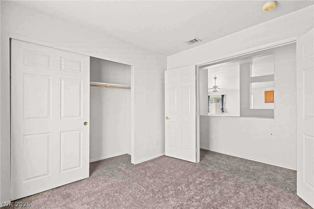 1815 Stablegate Avenue Henderson, NV 89012 - Photo 10 of 28 A well-lit room offers fresh carpeting and generous closet space.