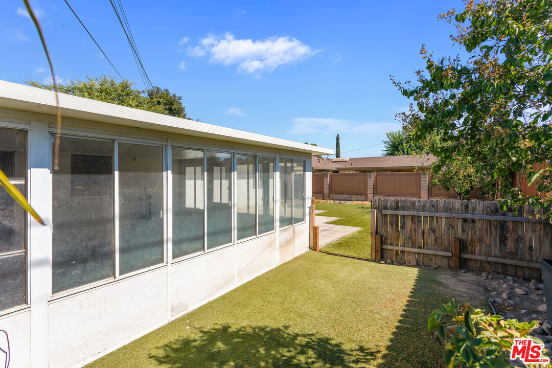 926 Barbra Lane Redlands, CA 92374 - Photo 20 of 23 a view of a house with a backyard and a patio