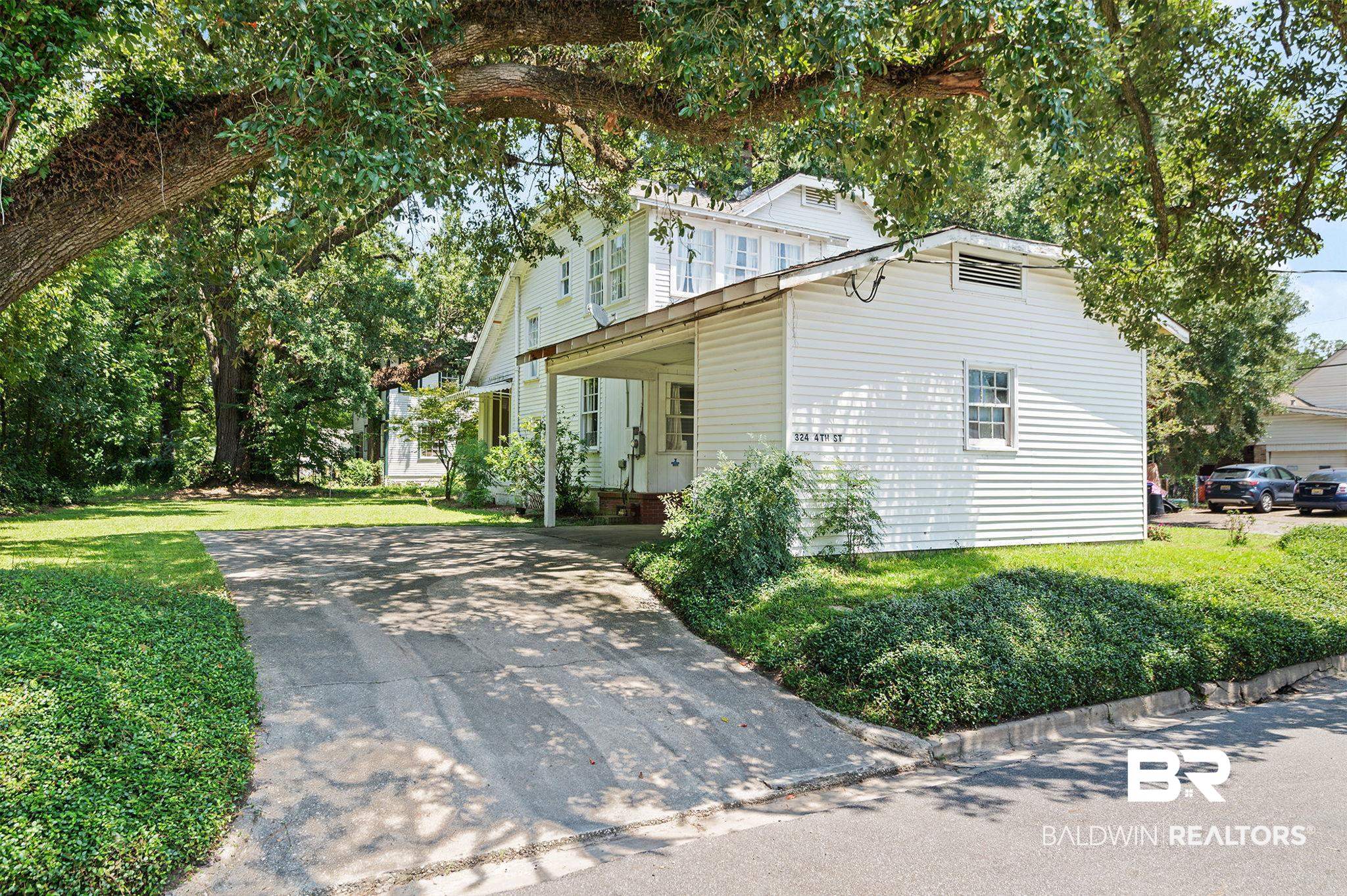 324 4th Street Mobile, AL 36611 - Photo 4 of 28 View of home's exterior featuring a yard