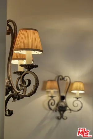 a bedroom with furniture and a flat screen tv