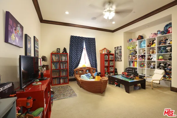 a bedroom with a large bed and a large window