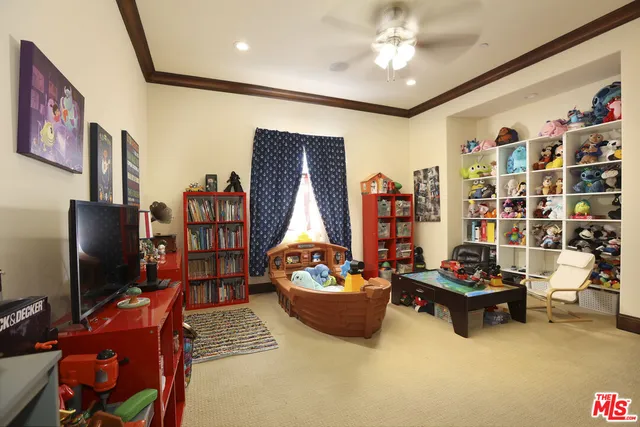 a bedroom with a large bed and a large window