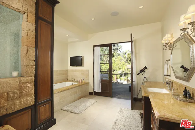 a view of a swimming pool with an outdoor seating