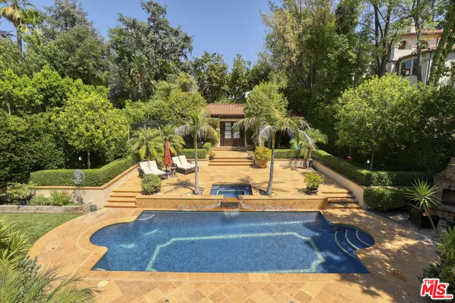 a view of a swimming pool with an outdoor space