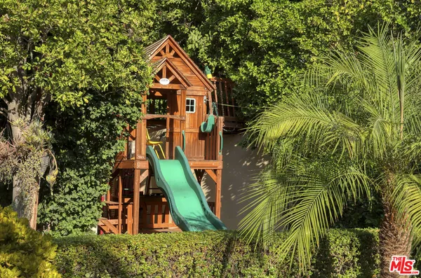 a view of a house with swimming pool