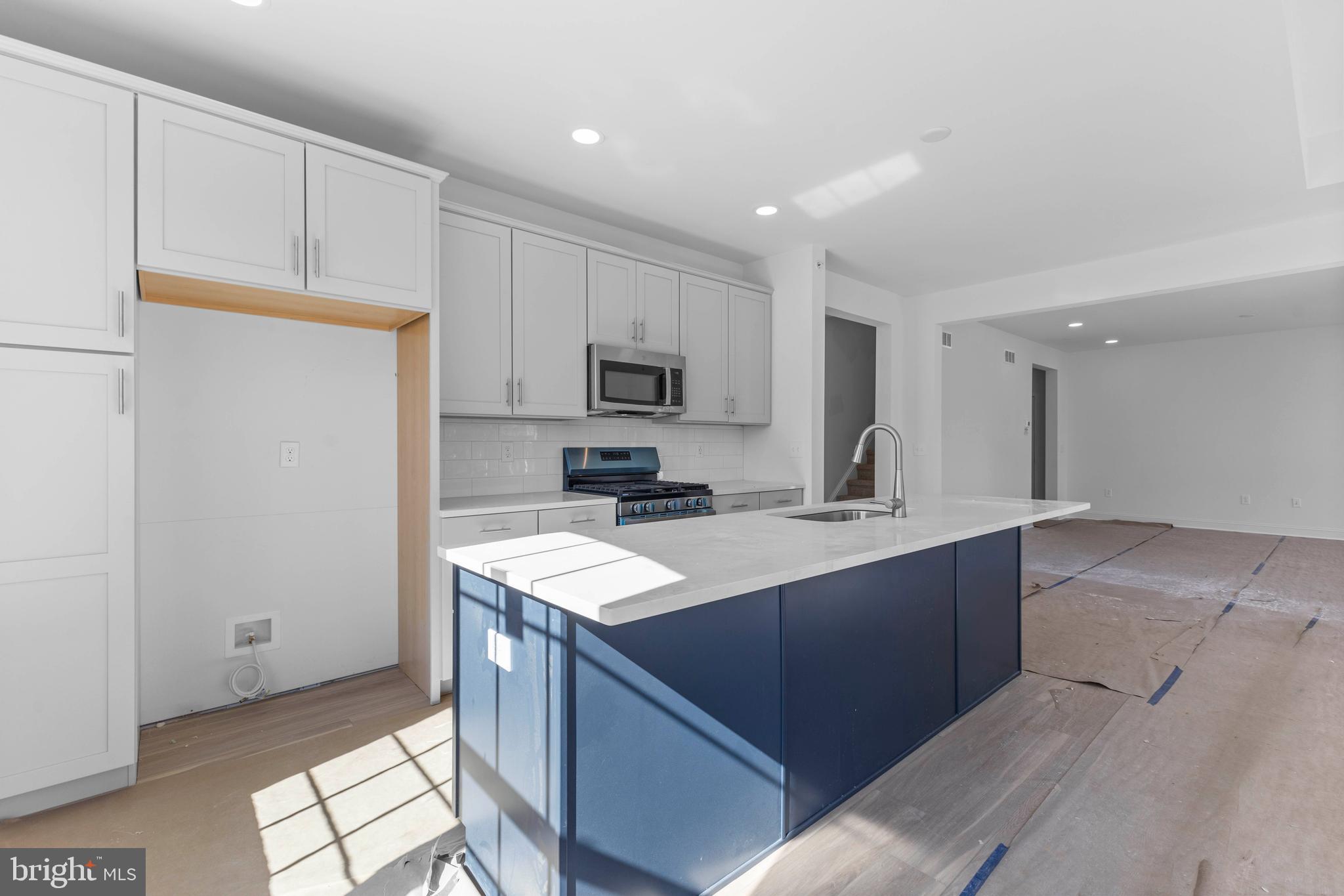 868 Veneto Court, Unit 66 Easton, PA 18040 - Photo 12 of 37 a kitchen with stainless steel appliances granite countertop a sink stove and refrigerator