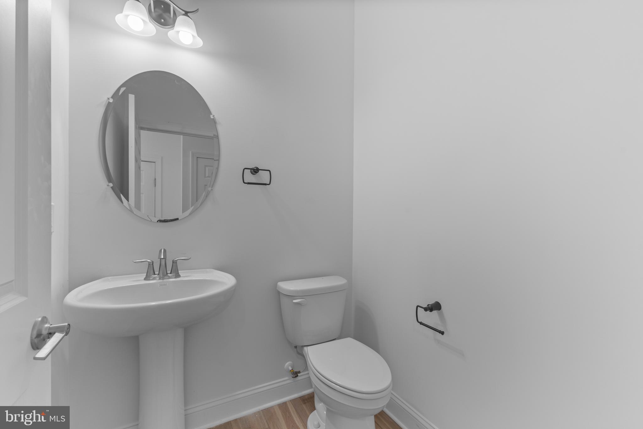 868 Veneto Court, Unit 66 Easton, PA 18040 - Photo 21 of 37 a bathroom with a toilet sink and mirror