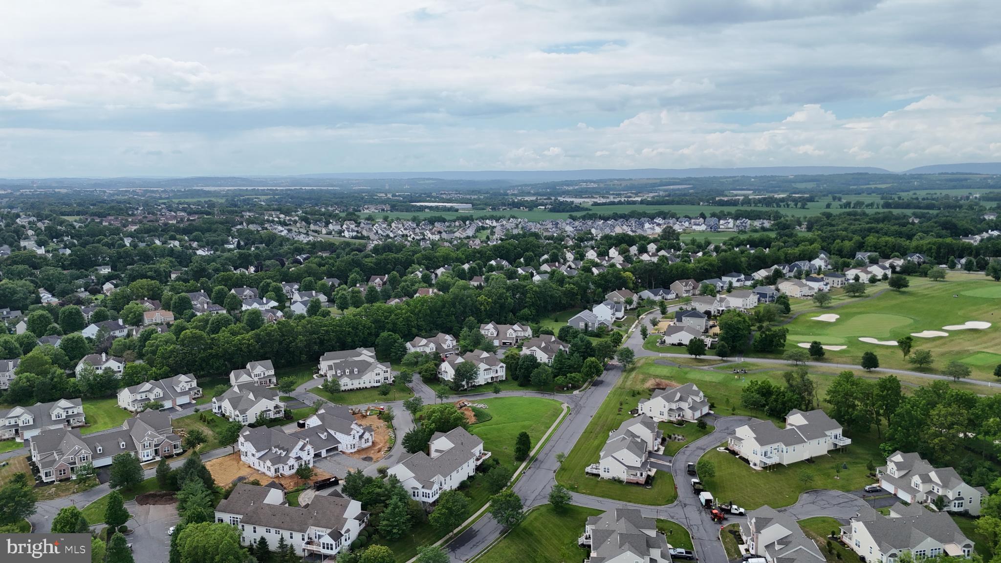 868 Veneto Court, Unit 66 Easton, PA 18040 - Photo 31 of 37 an aerial view of a city with lots of residential buildings ocean and mountain view in back