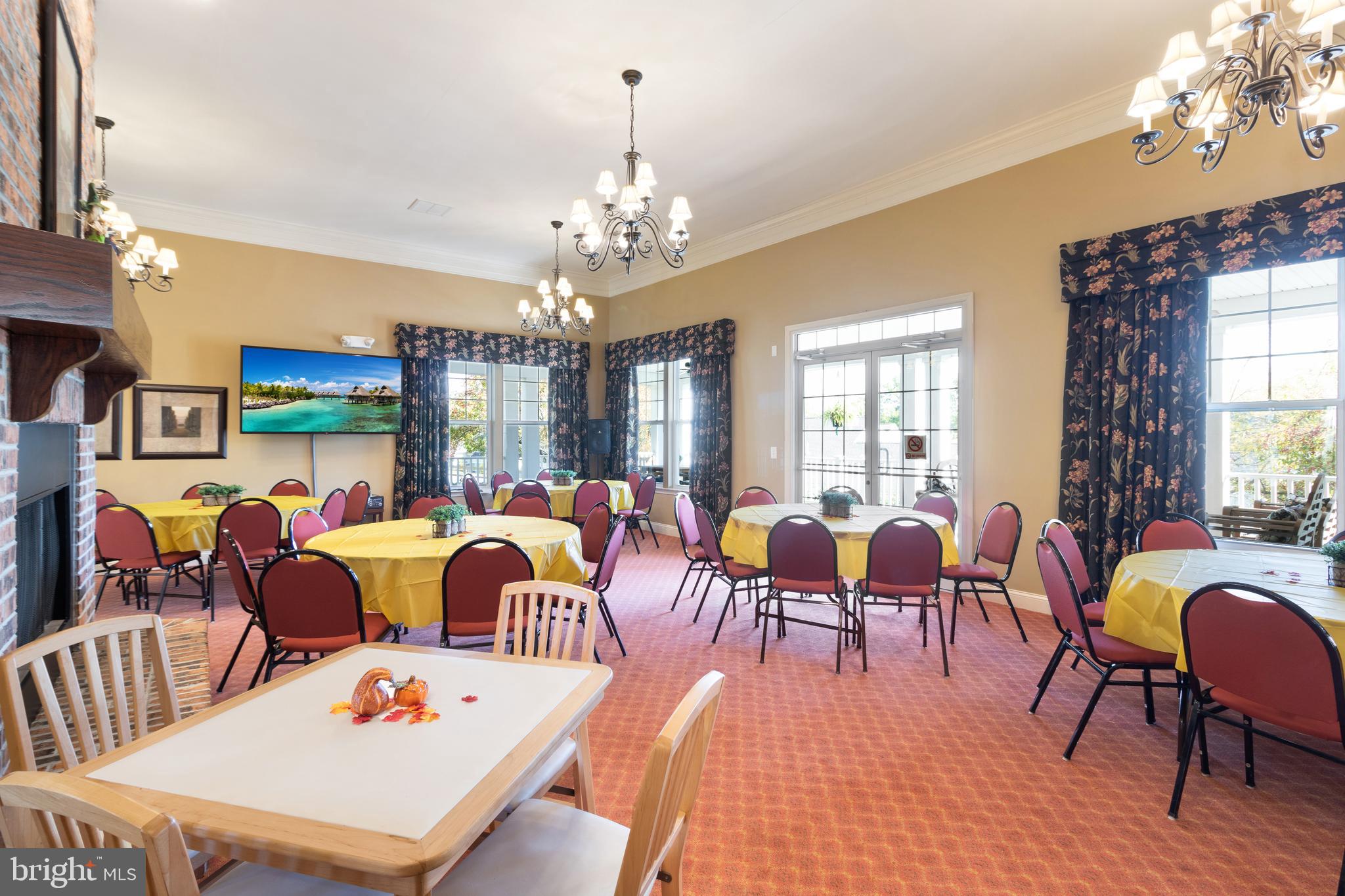 868 Veneto Court, Unit 66 Easton, PA 18040 - Photo 34 of 37 a living room with lots of furniture a chandelier a rug and a chandelier